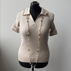 CHANEL Cream Ribbed Knit Polo with Chain Accent